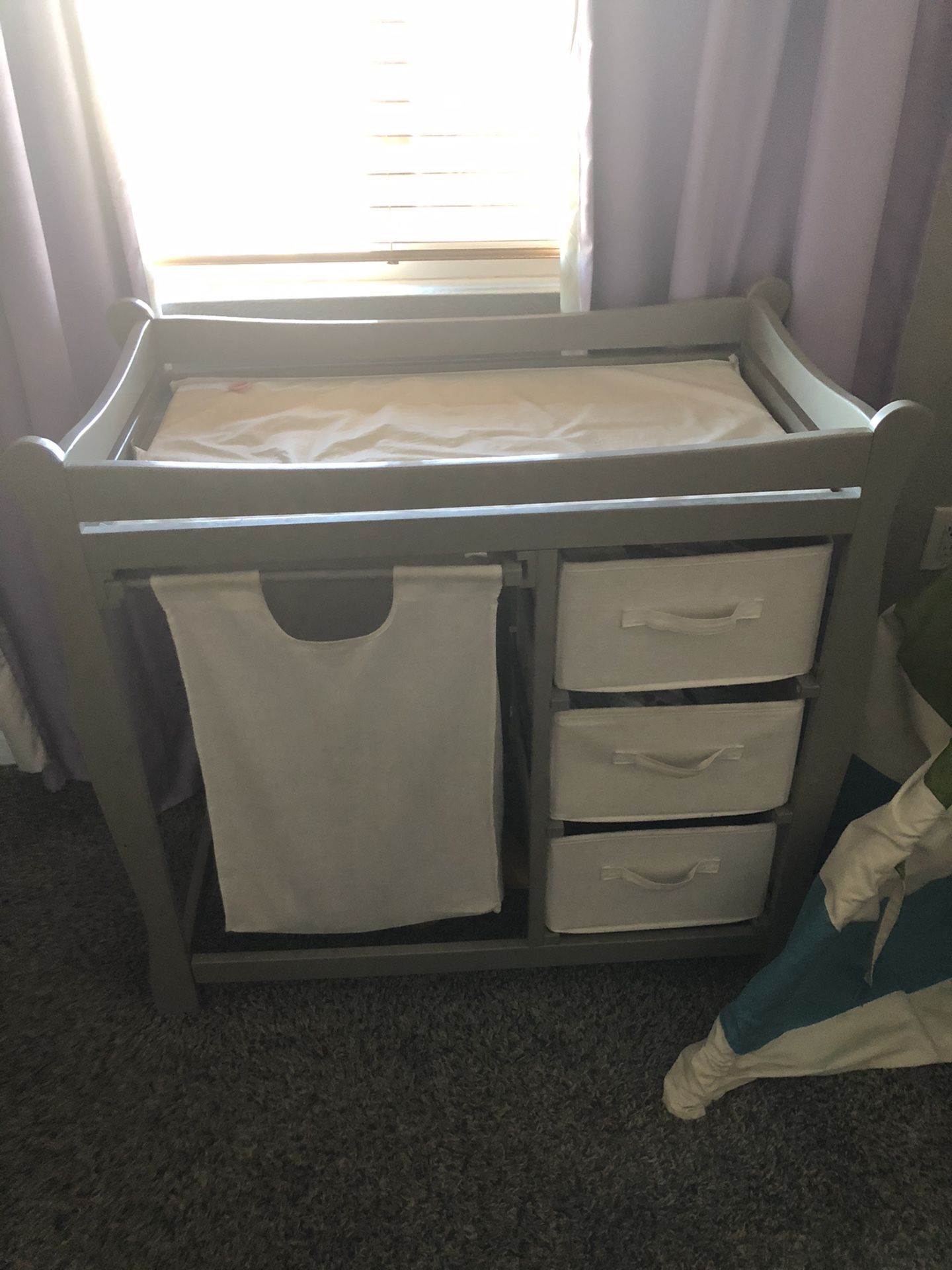 Changing table with drawers and hamper