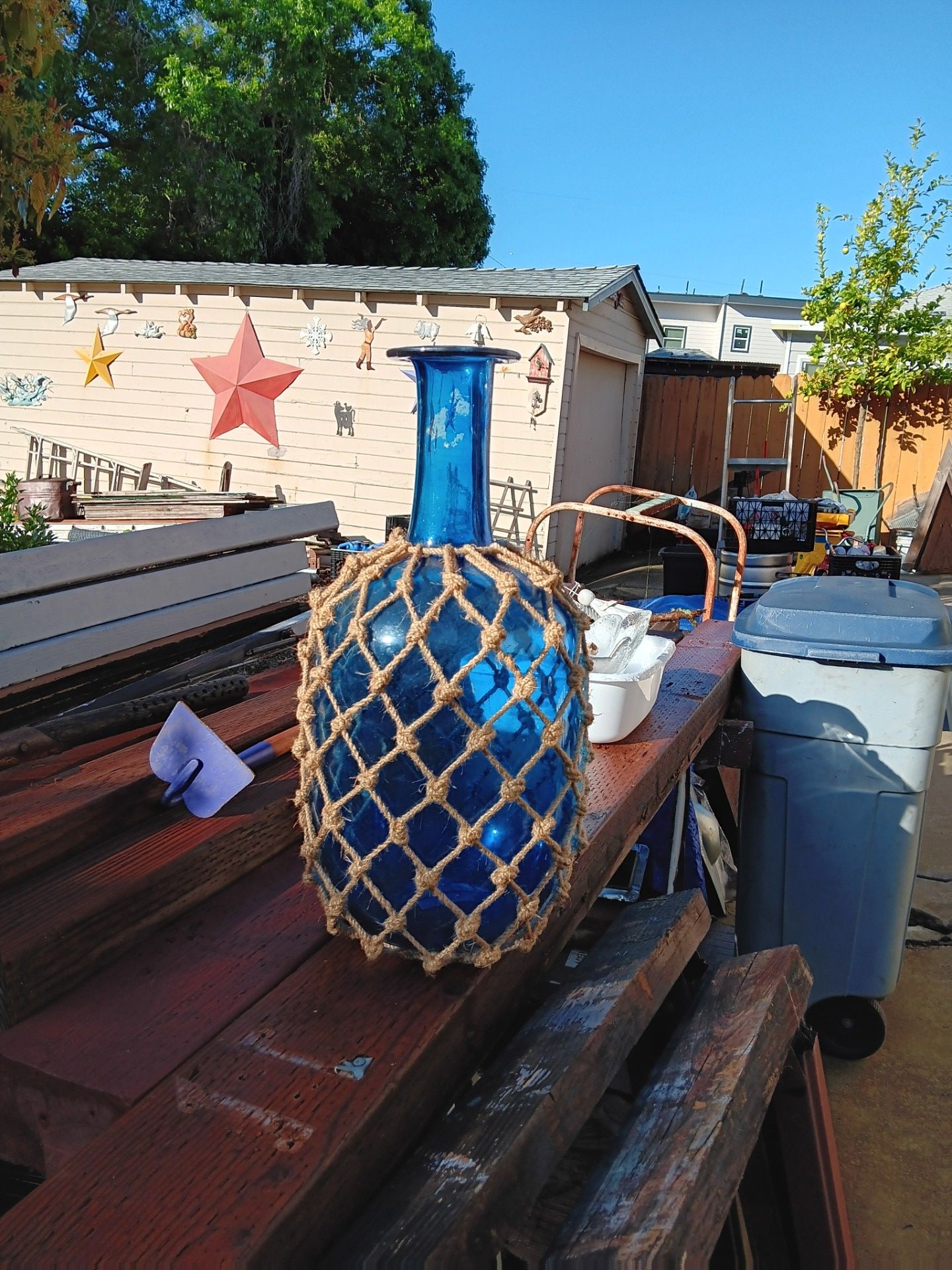 Blue glass bottle with net covered