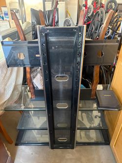 Tv mount with glass shelving.