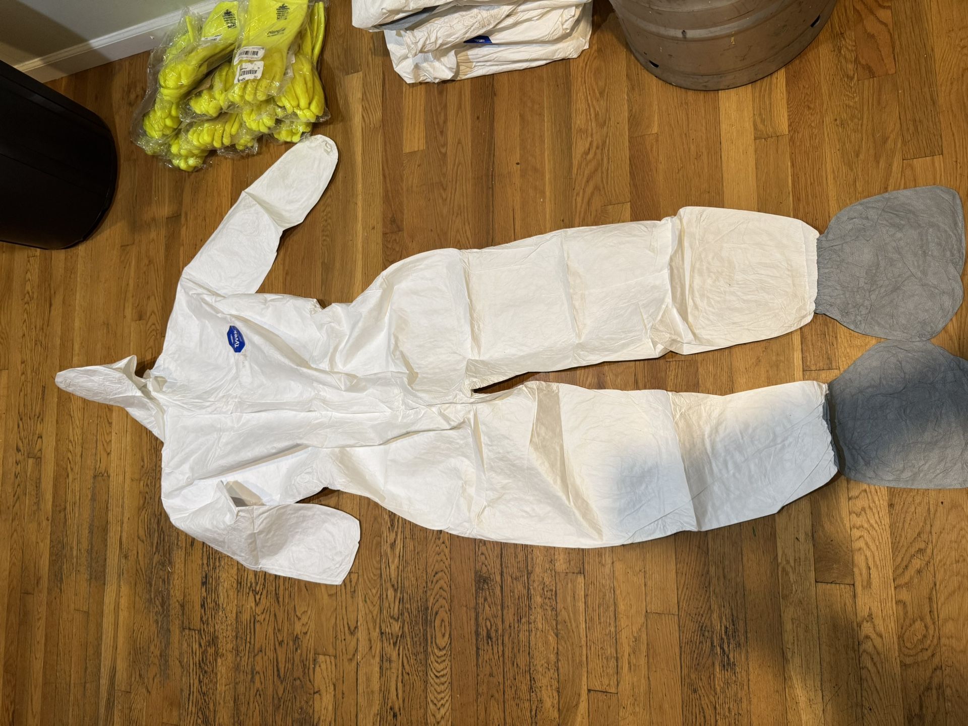 DuPont Tyvek 400 disposable protective coverall with an attached hood.