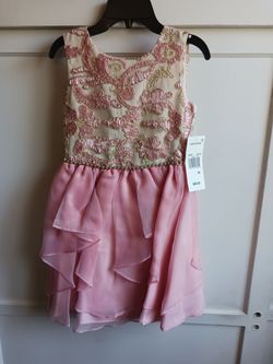 2 Brand New  dresses . Brand new. !