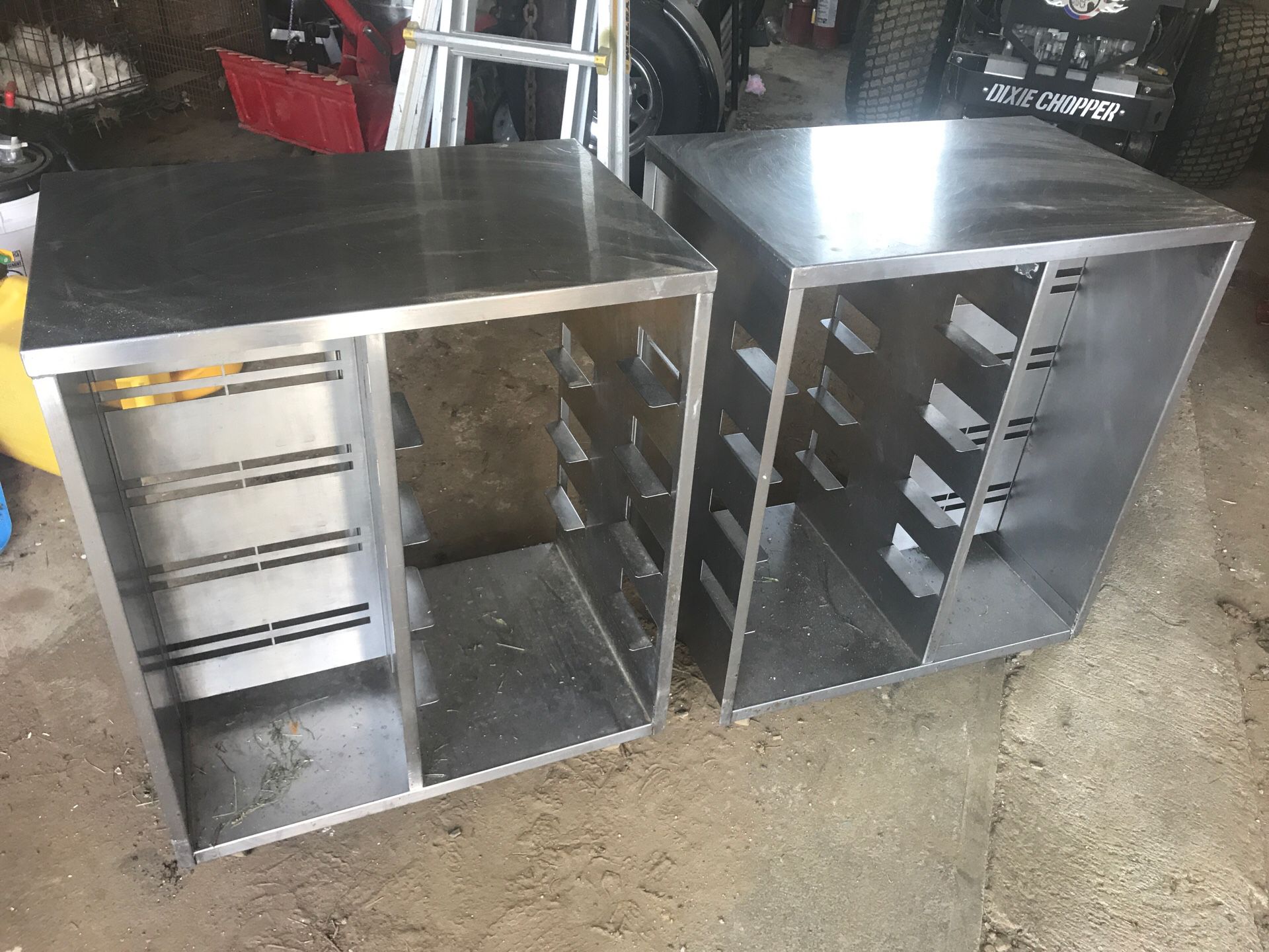 2 small roll around stainless tables.