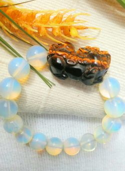 Moonstone bracelet with tiger eyes carved dragon lion energy stone