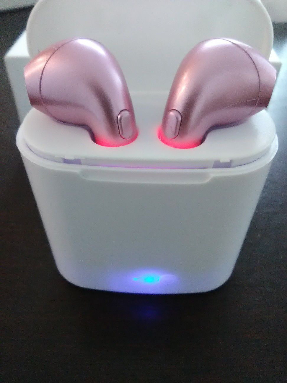 Brand new pink wireless Bluetooth headphones earbuds with wireless charger box included. These are not airpods