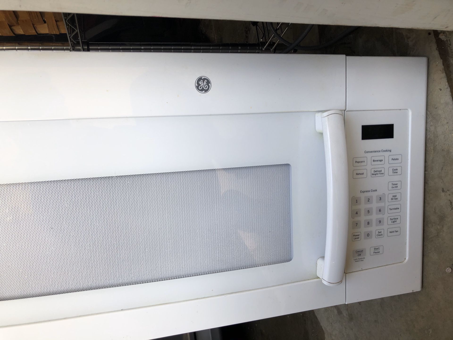 GE white over the top microwave & comes with wall mount.