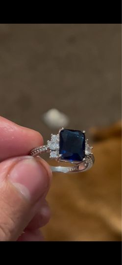 Sterling silver ring with blue gem stone and diamond