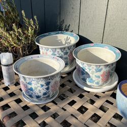 Porcelain planters with matching saucers