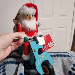 World Market Santa Riding A Scooter