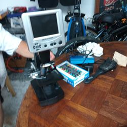 Celestron microscope with a built-in digital display. This is likely a model such as the Celestron TetraView LCD Digital Microscope