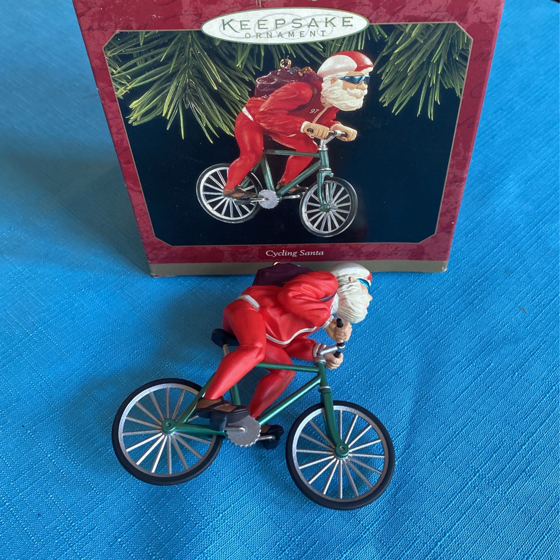 Hallmark keepsake ornament cycling Santa handcrafted dated 1997 in the original box