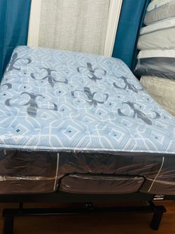 Adjustable Tempur-Pedic base (head and foot lift) with massage function; includes Stearns & Foster mattress; full size.