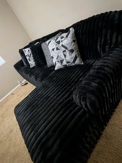 Black comfortable sectional couch