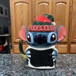 Disney Stitch Festive Mug with Lid, Lilo & Stitch.  There are no white spots on the mug the lightening is bad in the picture.  Brand new with tags.  S