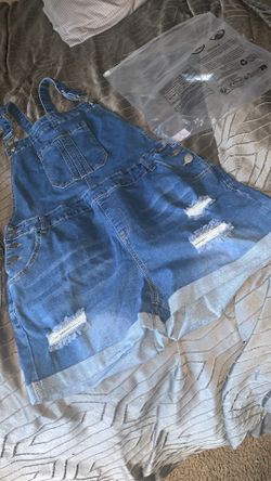 Ripped denim overalls