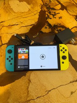 Nintendo Switch oled with Teal and Yellow Joy-Cons
