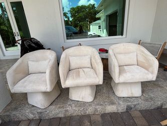 Set of 3 cream swivel barrel chairs