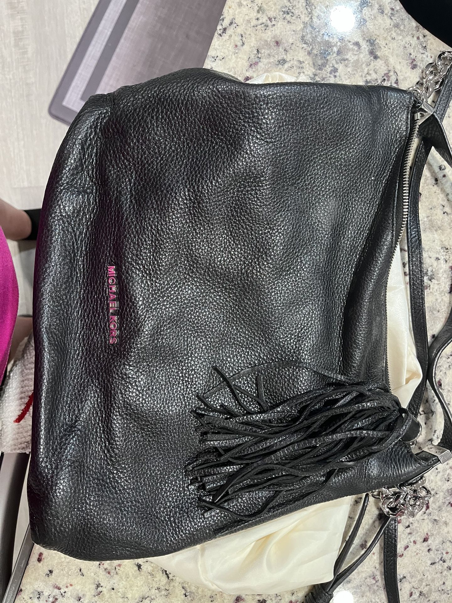 Like new Michael Kors, tassel crossover bag