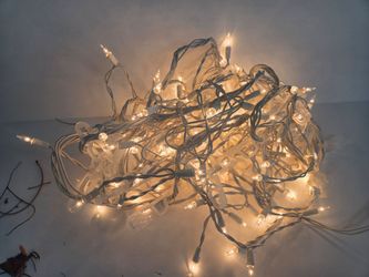 One set of white icicle lights with gutter clips