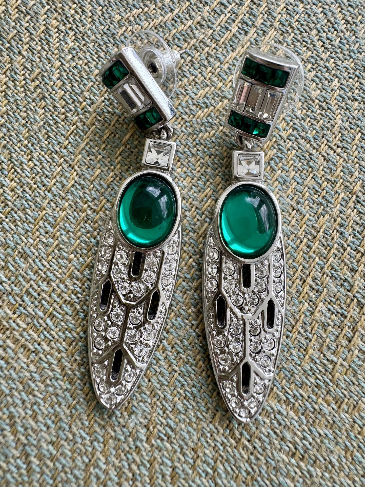 Vintage, circa unknown, designed earrings signed and designed by V&A Museum Shops. Featuring faux green cabochons accented both green and white crysta