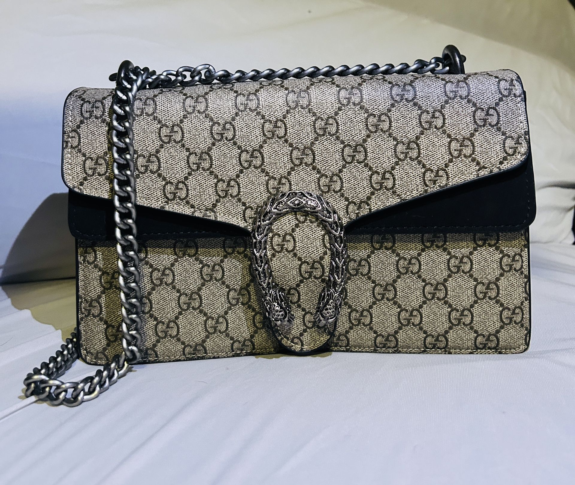Dinoysus Woman’s Gucci Bag