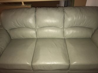 Rooms to go mint green leather sofa