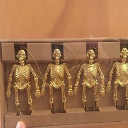 Gold Halloween skeleton ornaments 