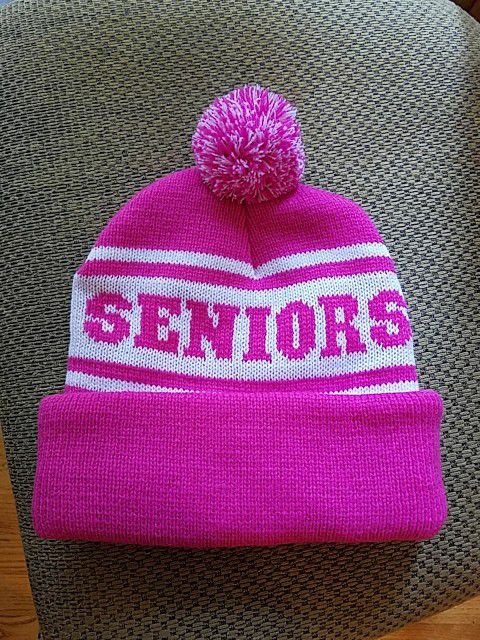 Pink and white knit hat