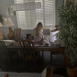 Wooden Dinning Table with 2 Leafs To Extend. 6 Re Upholstered Chairs. Solid Wood. Very Nice.