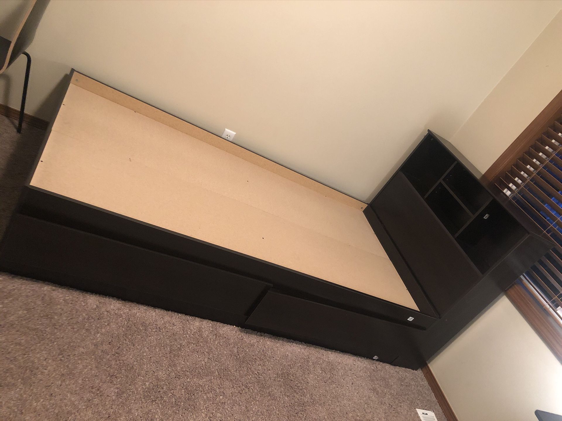 Twin bed frame with book storage