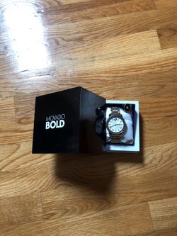 Movado Bold watch and black faced titanium ring with round 1.00 carat diamond