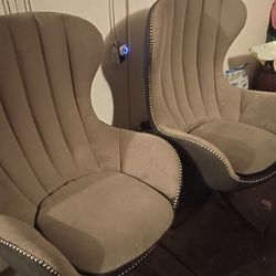 2 gray swivel chairs