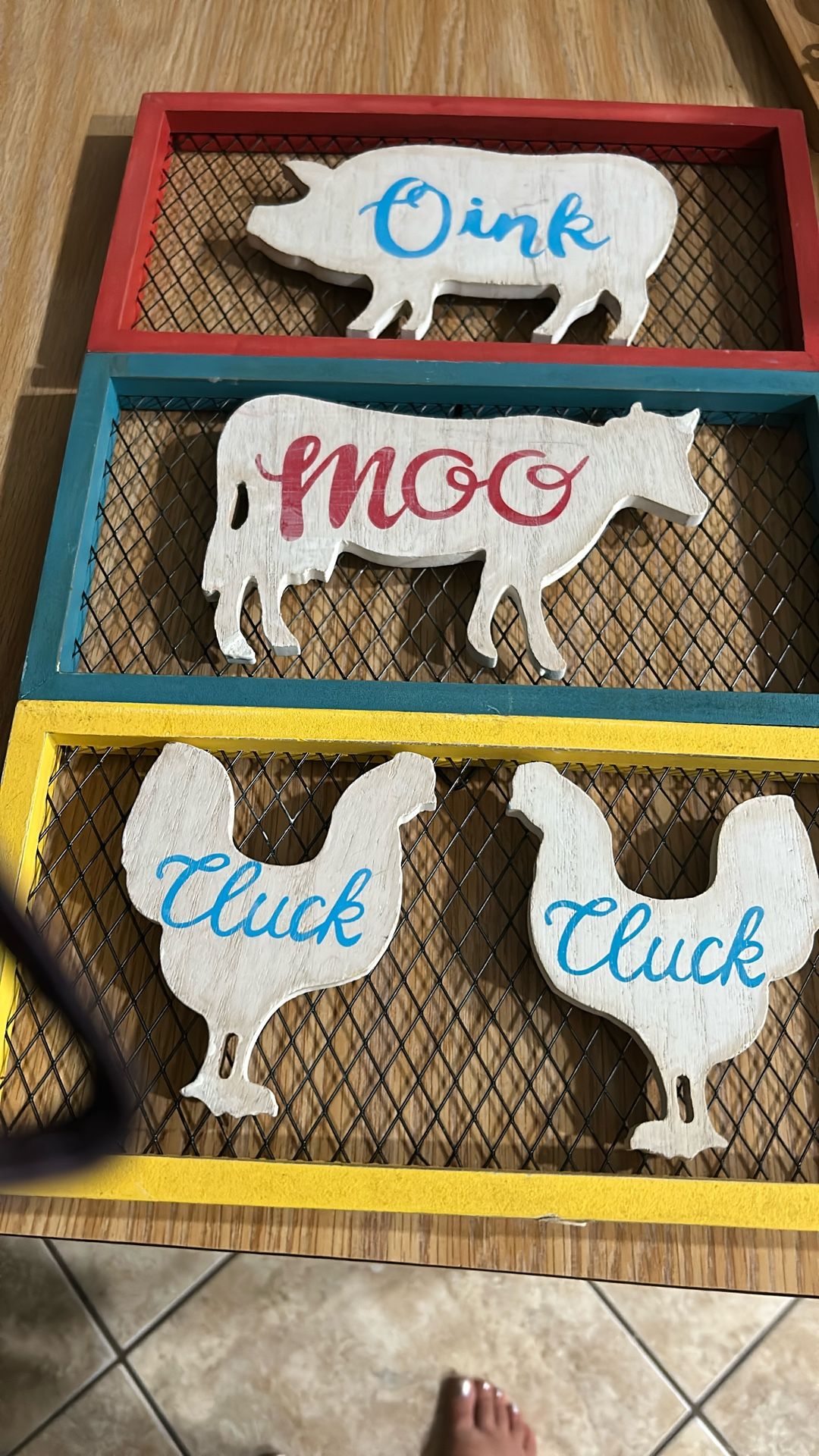 This charming set of farmhouse signs features a delightful trio of barnyard animals: a chicken, cow, and pig. Each sign is beautifully crafted from wo
