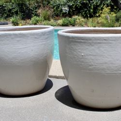 A Pair Of Ceramic Pots