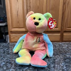Ty Beanie “Peace”  The Bear 1996 Retired Plush Toy.  Brand new with tags.  Had been on display with a Ty Beanie Babie Collection.  