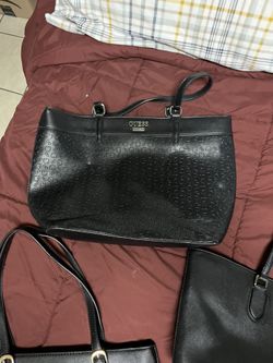 Black handbag by Guess.