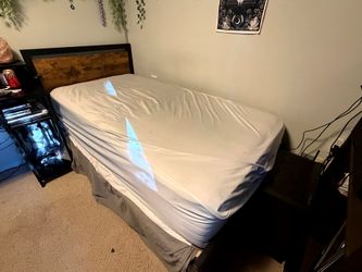Twin bed with frame, box spring, and mattress