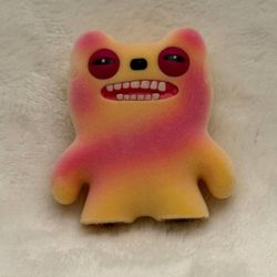 Fuggler 2.5" Orange Swirl Stinky monster mini figure with a fuzzy flocked finish