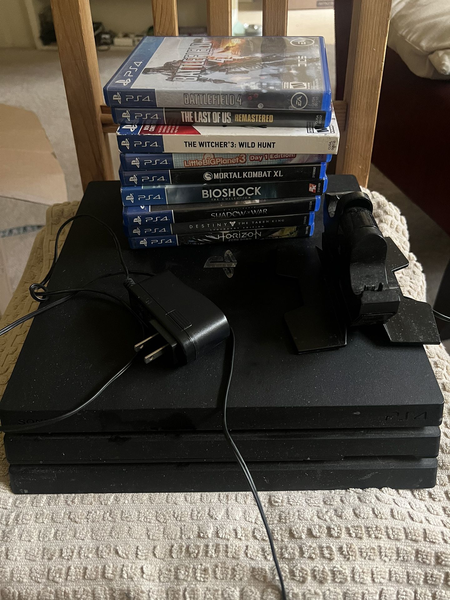 PS4 Pro Console, Assorted Games, Dual Controller Charger