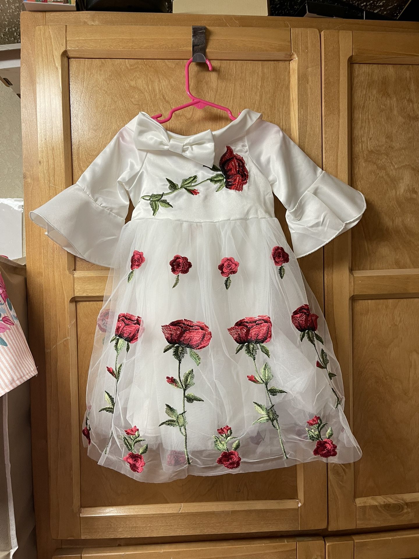 White dress with red rose embroidery