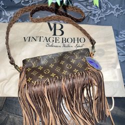 New Vintage rehabs old handbags with fringe, feathers and TLC