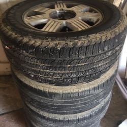 Four Tires On Aluminum Wheels Tread Good