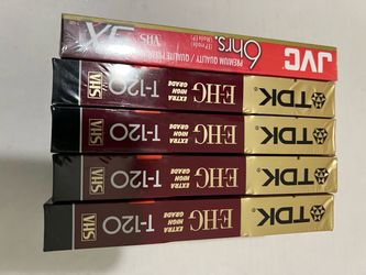 TDK EHG Extra High Grade T-120 VHS Tapes alongside a JVC VHS tape