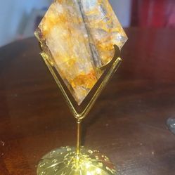 golden healer quartz crystal diamond shape and stand