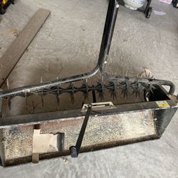 seed spreader mower attachment