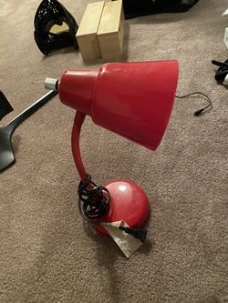 Red computer desk lamp.