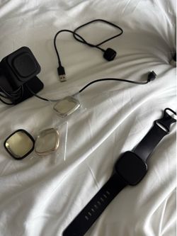 Fitbit Versa 3 Smartwatch + Charger + Charging Stand + 3 Cases – $85
