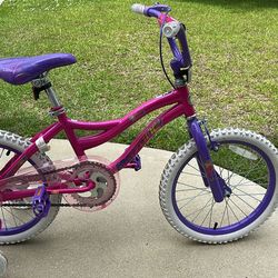 Girls bike with training wheels, good condition and ready to ride.
