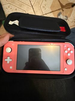 Pink Nintendo switch light with carrying case