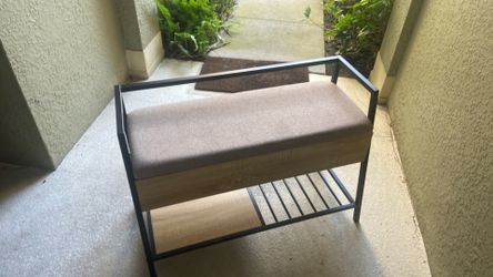 Storage bench with cushioned seat on top