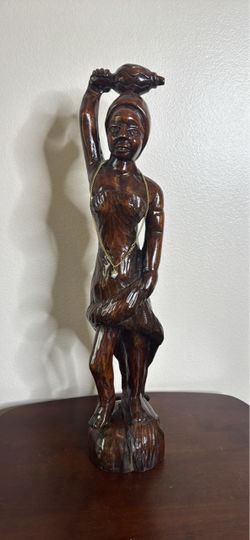 Hand-carved wooden woman statue